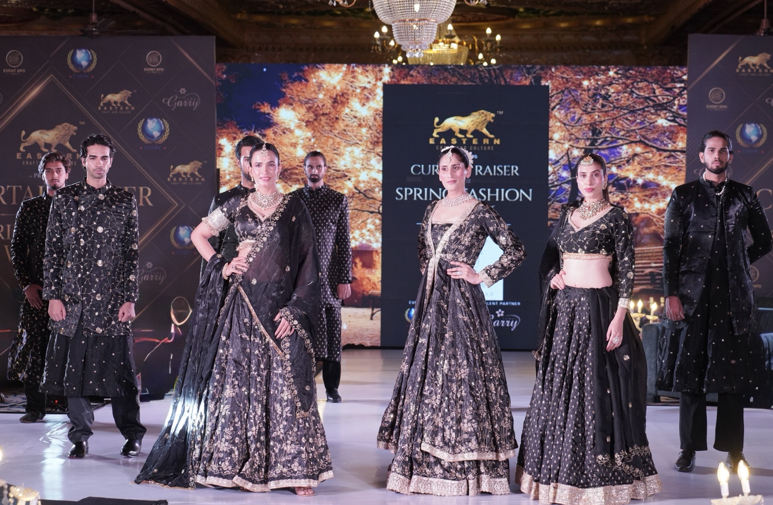 Fashion models at the close of a runway presentation